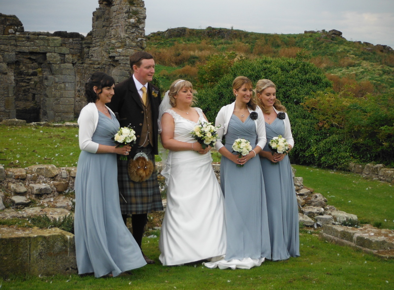  the bride and groom with the bridesmaids 