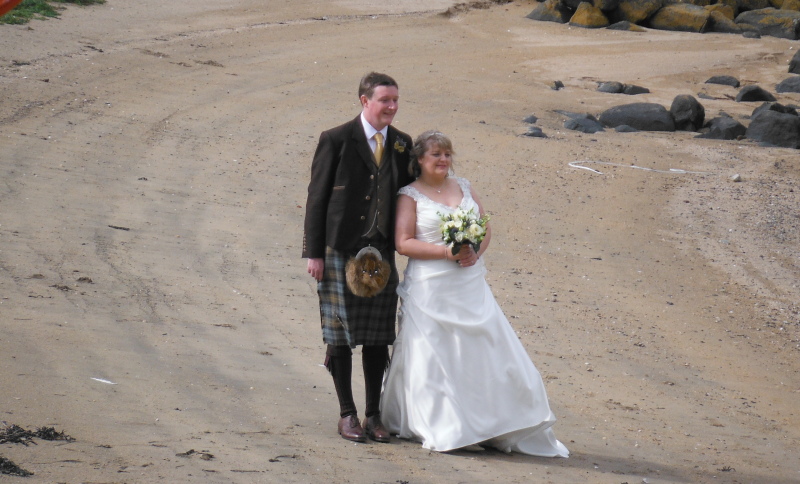  the bride and groom on the beach